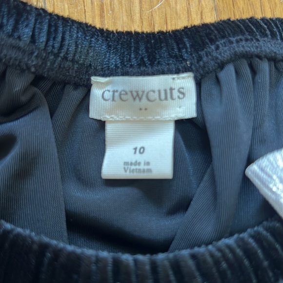 Black velvet puffed sleeve peplum bottom with silver bow accent at the neckline - Picture 3 of 4